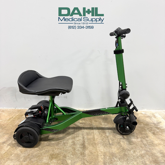 Side profile of a used Drive iRIDE S25 3-wheel mobility scooter showing low-profile frame, rear wheels, front wheel, and seating position.
