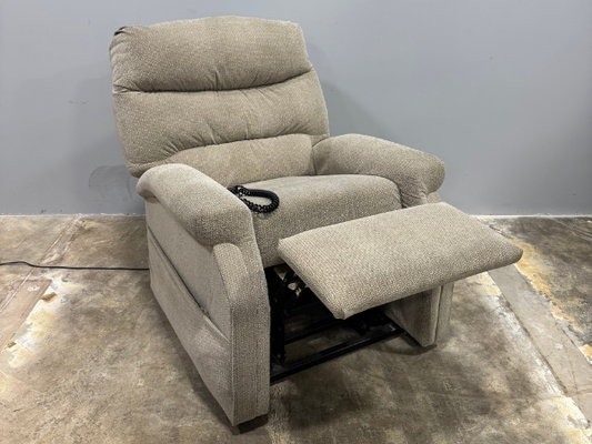 Front angled view of a used Pride CL20 power lift chair with the footrest raised, showing padded armrests, comfortable seating, and easy-to-use hand control.