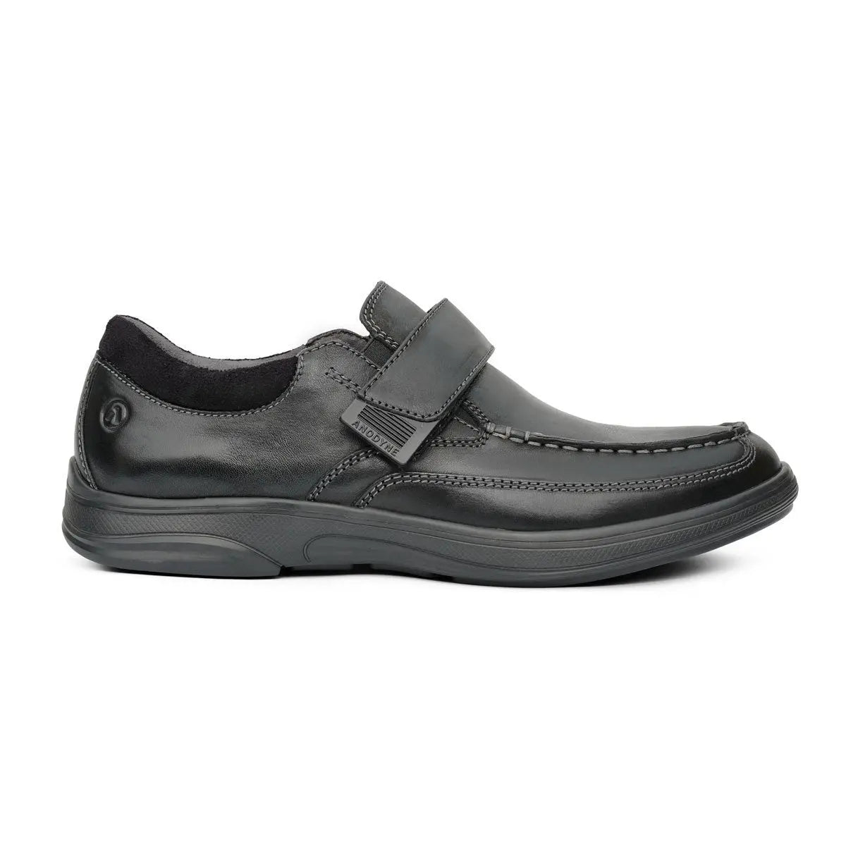Side view of the Anodyne No. 52 black casual shoe with hook-and-loop strap, moc toe stitching, and orthopedic sole designed for diabetic foot care and everyday comfort.