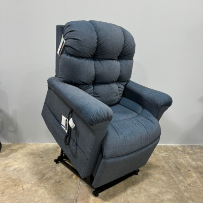 Used blue power lift chair from Dahl Medical Supply featuring plush cushioning and handheld remote, offering comfort, support, and easy mobility assistance.