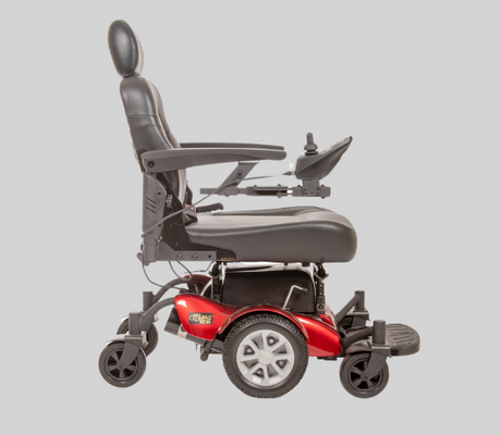 Full-size power wheelchair in red and black with padded captain’s seat, footplate, and joystick control—available at Dahl Medical Supply for long-range mobility and comfort.