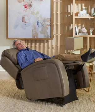 Person reclining in an infinite position lift chair rented from Dahl Medical Supply in Burnsville
