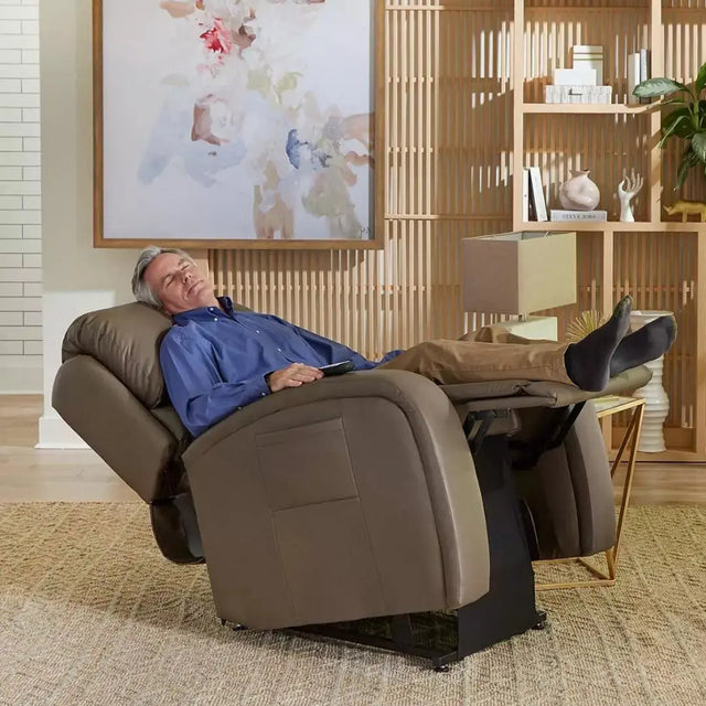 Man sleeps in brown infinite lift chair rental