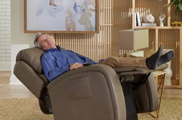 Man sleeps in brown infinite lift chair rental