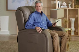 man sits in brown lift chair rental
