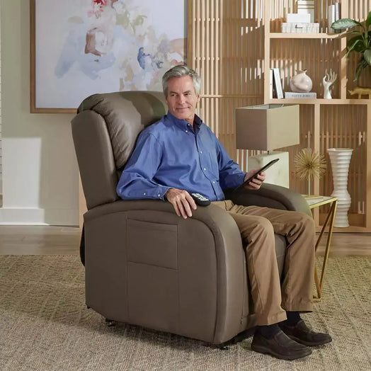 man sits in brown lift chair rental