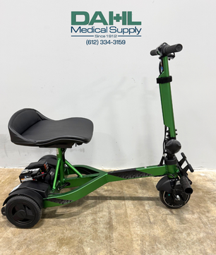 Side profile of a used Drive iRIDE S25 3-wheel mobility scooter showing low-profile frame, rear wheels, front wheel, and seating position.