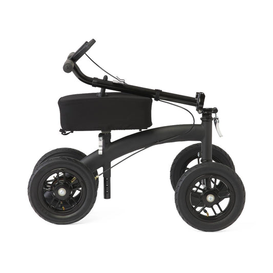 Medline All-Terrain Knee Walker shown in folded position with handlebars down, padded knee rest, and large wheels for compact storage and transport.