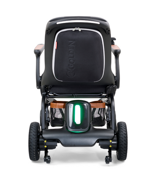 Rear view of the Golden Ally GP303 portable power wheelchair featuring the illuminated rear safety light, all-terrain wheels, backrest storage pocket, and sturdy frame design.