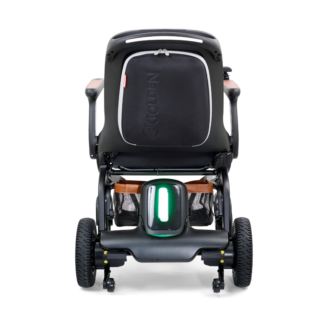 Rear view of the Golden Ally GP303 portable power wheelchair featuring the illuminated rear safety light, all-terrain wheels, backrest storage pocket, and sturdy frame design.