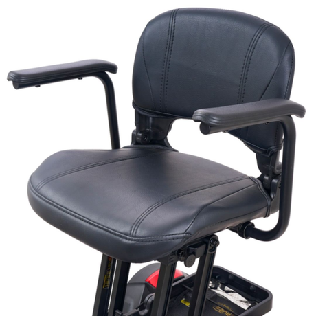 Padded seat with armrests on the Golden Buzzaround CarryOn GB120 scooter.