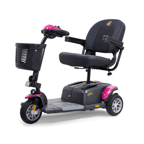 Golden Buzzaround EX 3-wheel mobility scooter with pink accents, padded seat, armrests, front basket, and compact three-wheel design