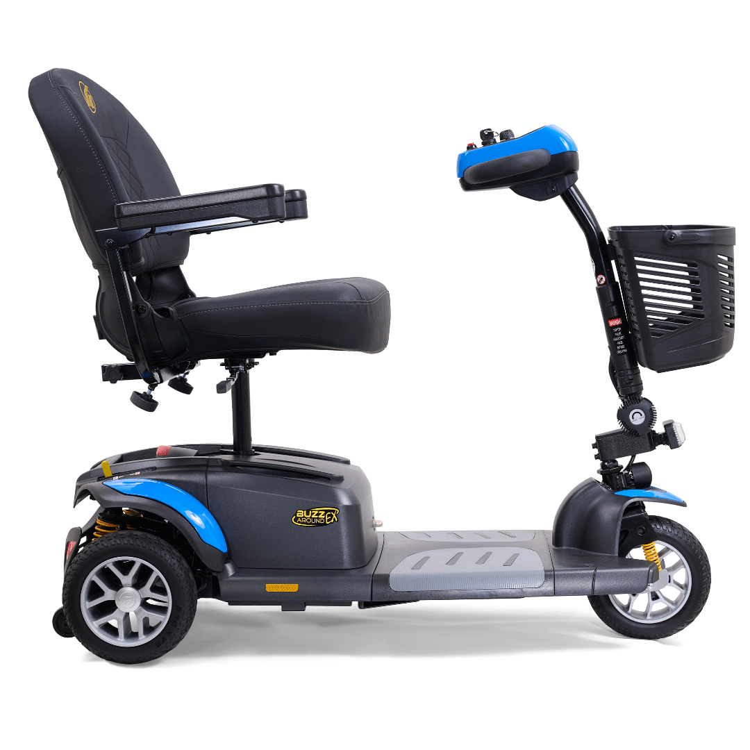 Side view of the Golden Buzzaround EX 3-wheel mobility scooter showing padded seat, armrests, front basket, and compact three-wheel design