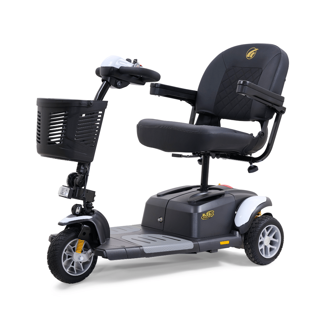 Golden Buzzaround EX 3-wheel mobility scooter with white accents, padded seat, armrests, front basket, and compact three-wheel design