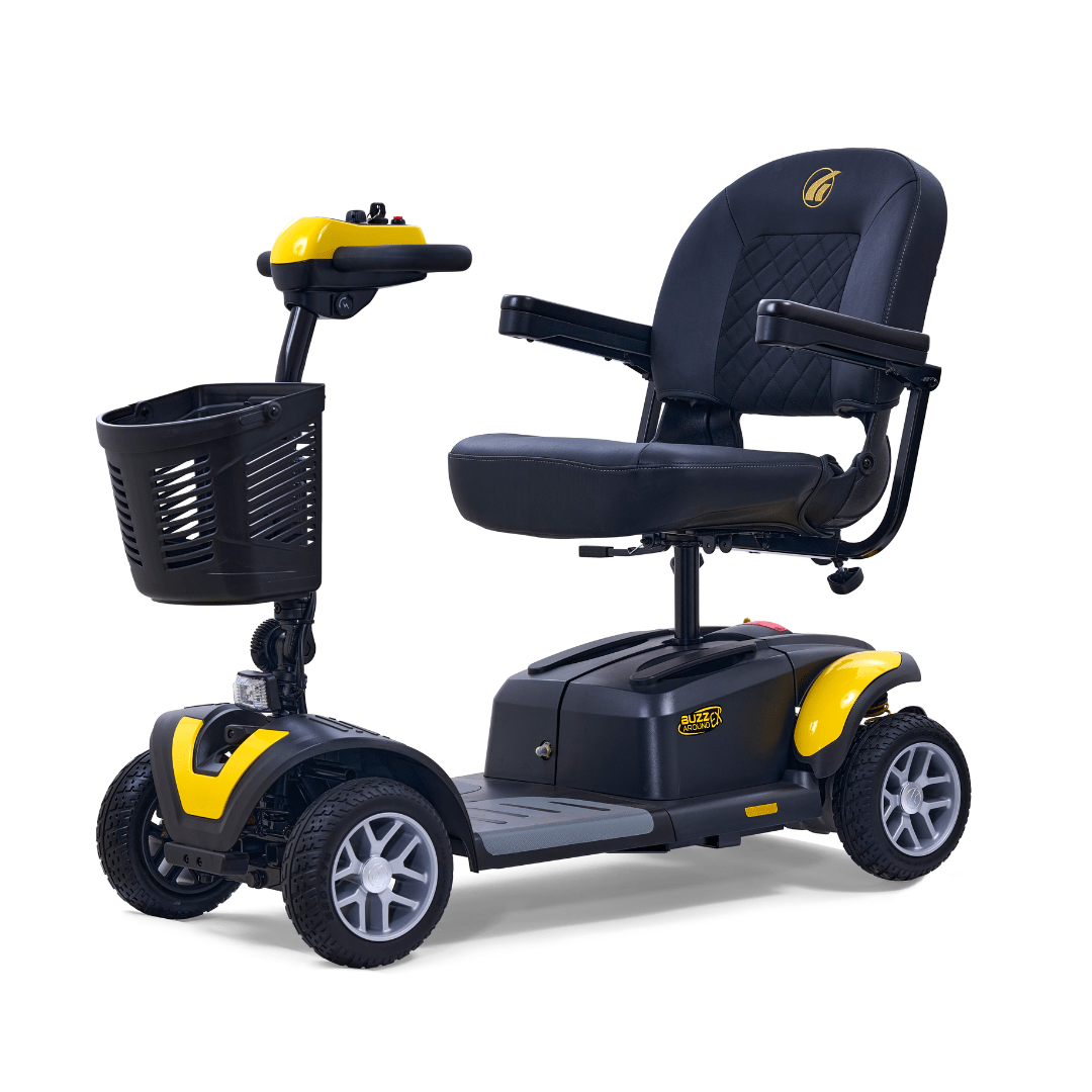 Golden Buzzaround EX 4-wheel mobility scooter with yellow accent panels, padded seat, front basket, and four wheels on a white background