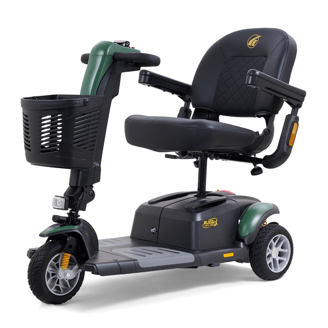Green Golden Buzzaround LX 3-wheel mobility scooter with contoured seat, armrests, front basket, and compact indoor-friendly design.