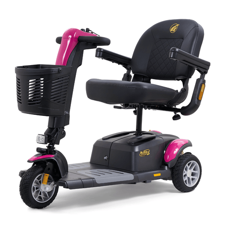 Pink Golden Buzzaround LX 3-wheel mobility scooter with cushioned seat, adjustable armrests, front basket, and compact frame.