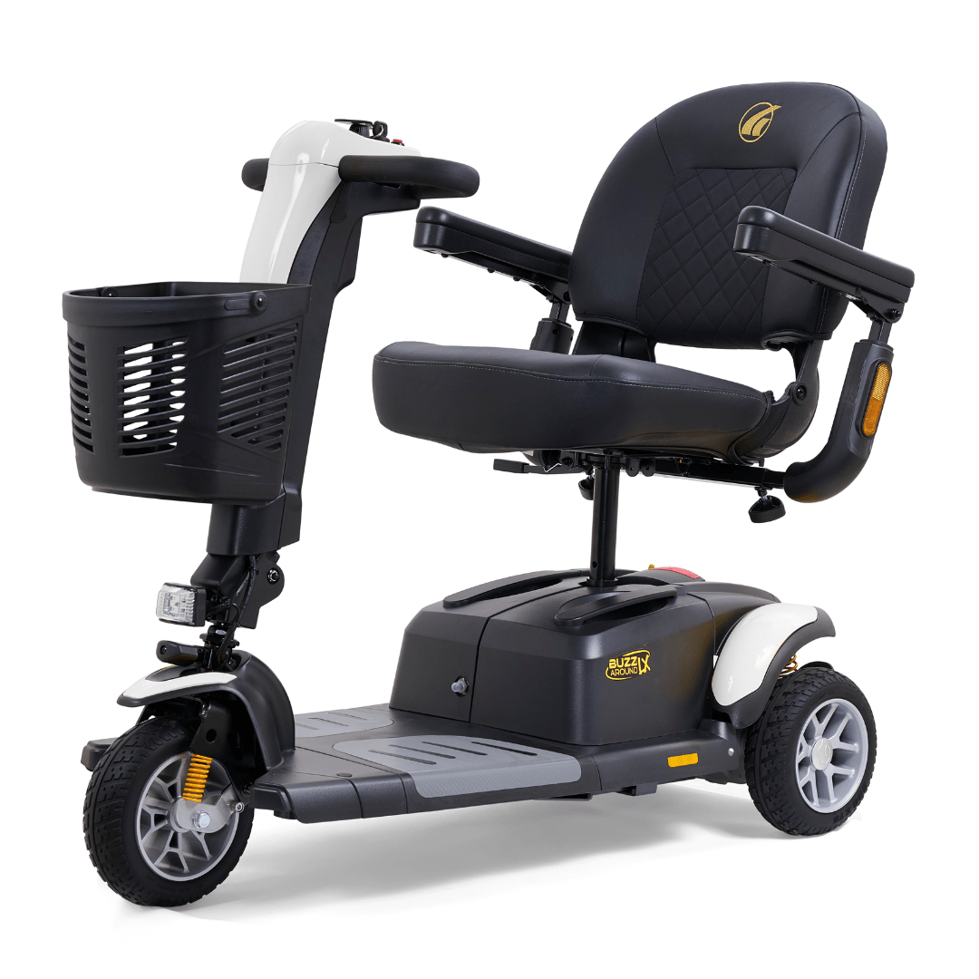 White Golden Buzzaround LX 3-wheel mobility scooter with contoured seat, armrests, front basket, and compact maneuverable design.