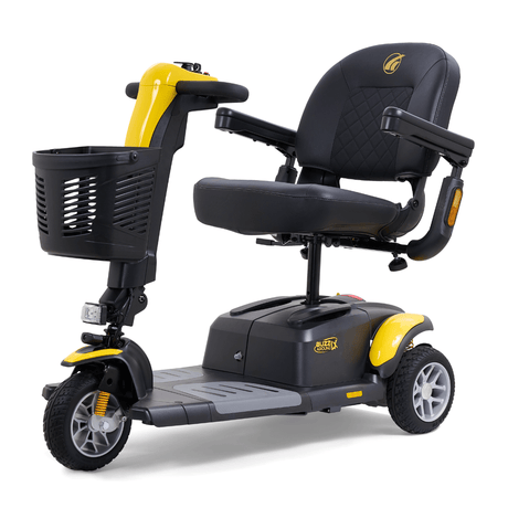 Yellow Golden Buzzaround LX 3-wheel mobility scooter shown with padded seat, armrests, front basket, and three-wheel configuration.