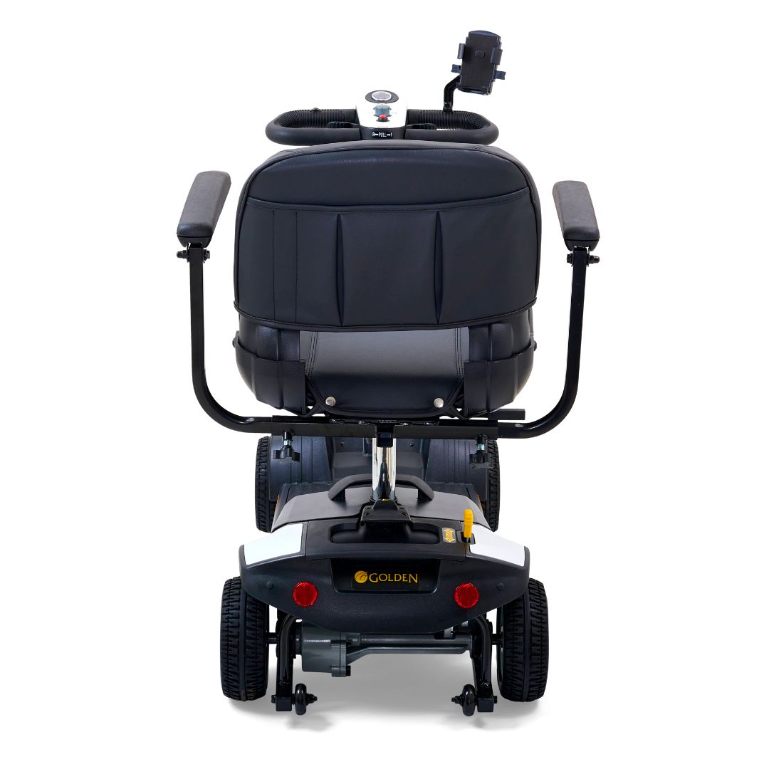 Rear view of the Golden Buzzaround XL 4-wheel mobility scooter showing padded seat back, rear wheels, and reflectors.