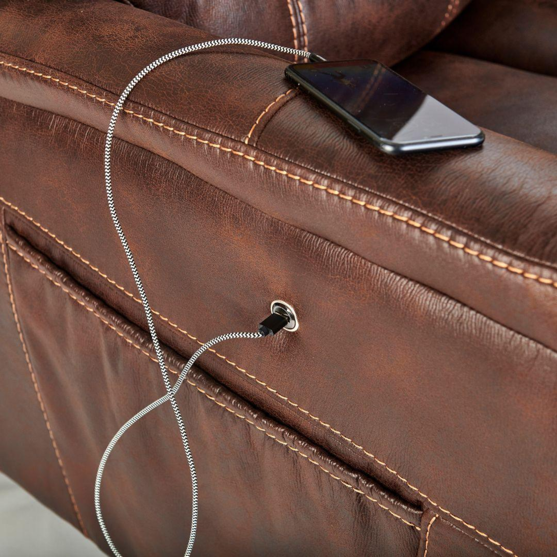 Close-up of Golden Dione PR446 Lift Chair USB charging port and side pocket in maple faux leather at Dahl Medical Supply Burnsville MN