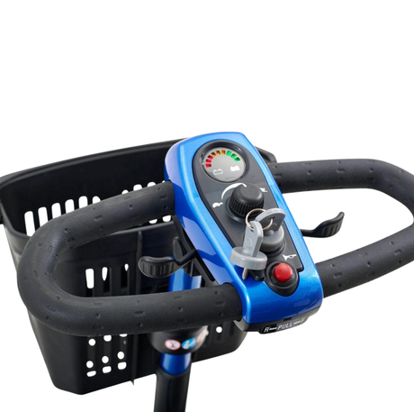 Close-up of the Golden LiteRider mobility scooter control panel with throttle, key switch, battery indicator, and front basket