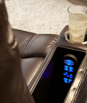 Close-up of Golden PR442 lift chair arm showing storage compartment, backlit remote, and cup holder.