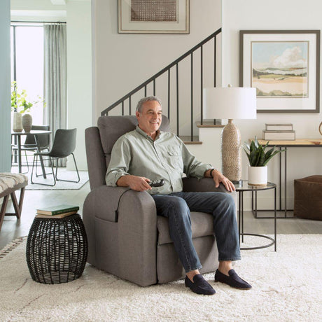 Man sitting comfortably in the Golden Technologies PR764 Medium EZ Sleeper Slim Lift Chair