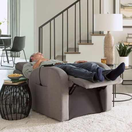 Man relaxing in a Golden PR764 Medium EZ Sleeper Slim Lift Chair with Twilight positioning