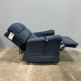 Golden PR515-Small MaxiComfort® Lift Chair in Steel upholstery shown in a relaxed recline position with extended footrest and supportive back cushioning — offering zero-gravity comfort and PowerPillow™ headrest, available at Dahl Medical Supply, Burnsville, Minnesota.