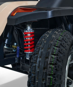 Heavy-duty suspension and wide-tread tire designed to improve stability, traction, and ride comfort for outdoor mobility use.