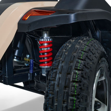 Heavy-duty suspension and wide-tread tire designed to improve stability, traction, and ride comfort for outdoor mobility use.
