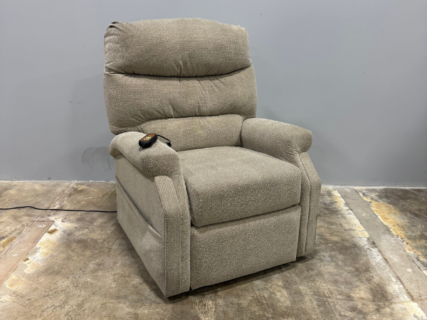 Front view of a used Pride CL20 lift chair in the upright seated position, highlighting the cushioned seat, supportive backrest, and compact home-friendly design.