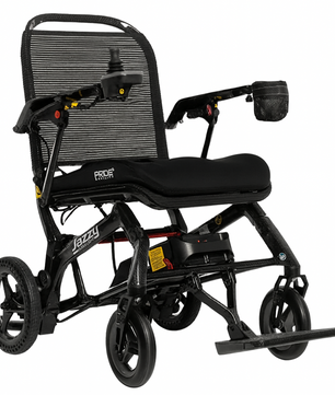 Jazzy Carbon lightweight folding power wheelchair with a breathable mesh back, padded seat, joystick controller, and compact travel-friendly frame.