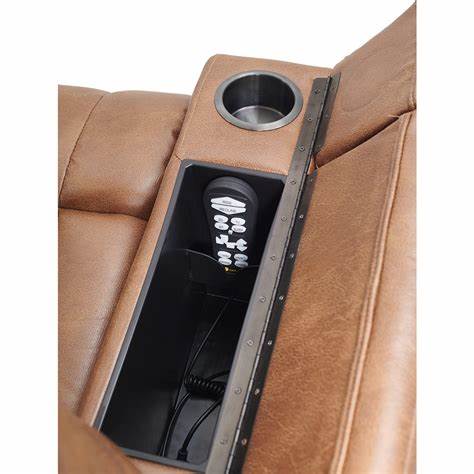 Close-up view of the Golden Technologies Rhea PR442-MED lift chair armrest in acorn color, showing built-in storage compartment with hand control, USB port, and stainless cup holder.