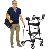 Man standing next to a folded Vive Upright Rollator Walker, holding a cane and carrying the included storage bag over his shoulder. Lightweight, portable, and easy to transport – available at Dahl Medical Supply for $225.