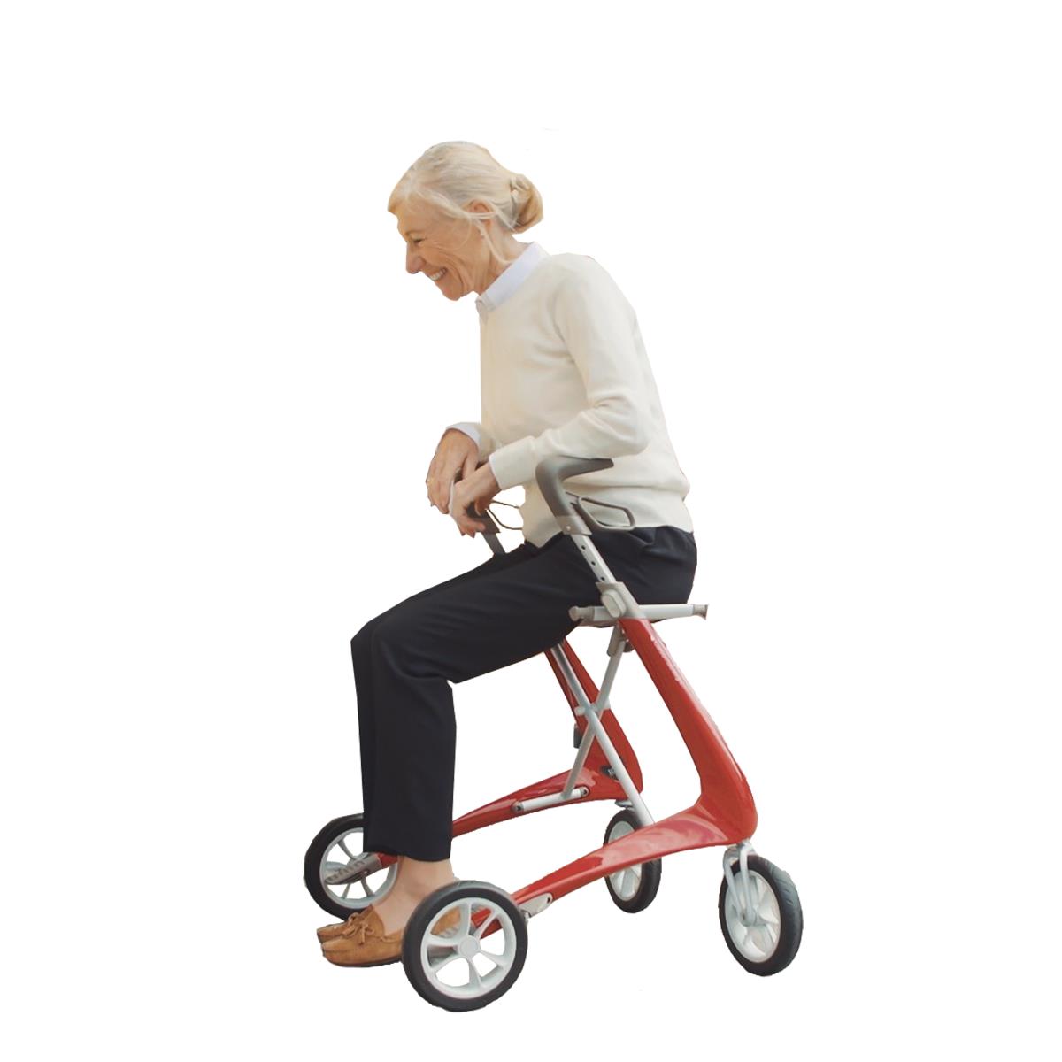 Person seated on the byACRE Ultralight Carbon Fiber Rollator in red, demonstrating its comfortable rest feature, available at Dahl Medical Supply.
