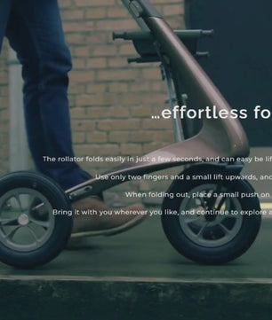 Person walking with the byACRE Ultralight Carbon Fiber Rollator, demonstrating smooth and stable mobility support