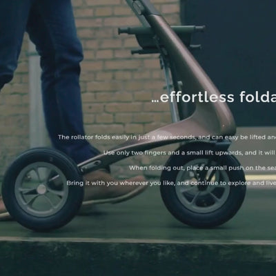 Person walking with the byACRE Ultralight Carbon Fiber Rollator, demonstrating smooth and stable mobility support