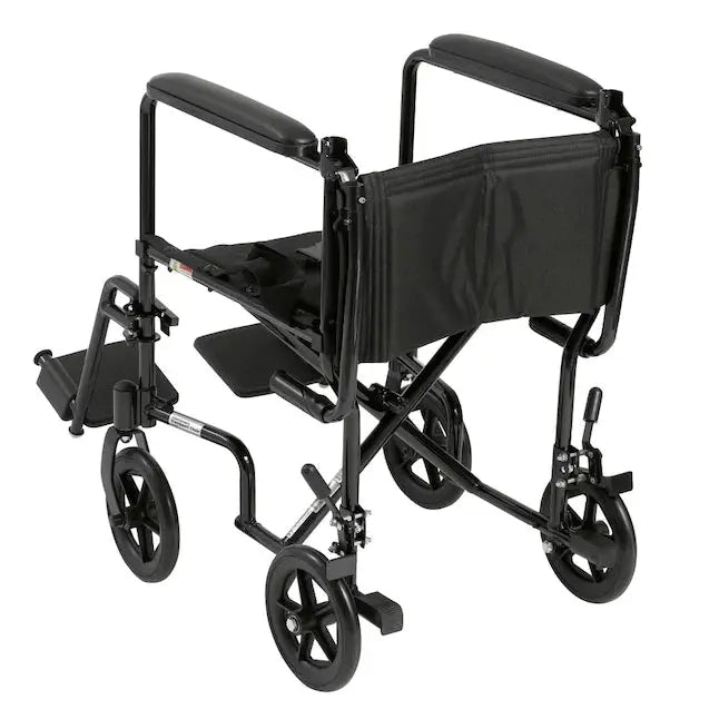 Rear view of a lightweight black folding transport chair showing compact frame, swing-away footrests, and easy-fold design for transport. Available for weekly rental at Dahl Medical Supply in Burnsville, Minnesota.
